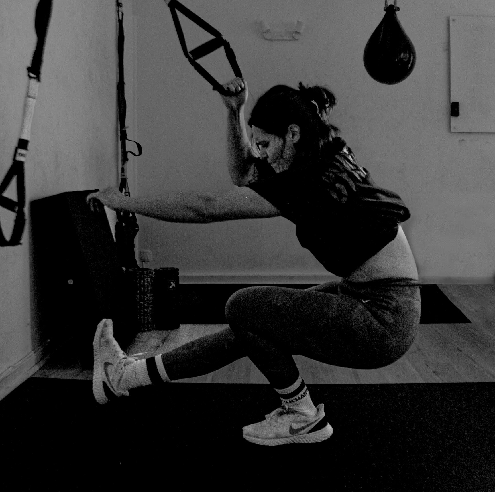 Stretching and mobility work on the gym floor
